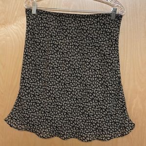 Vintage Flower print, black and beige skirt. Has a built in black slip. Size L.